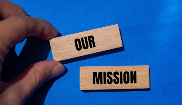 our-mission-message-written-wooden-blocks-with-blue-background-conceptual-our-mission-symbol-copy-space-min